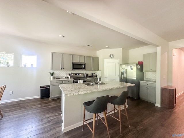 117 Edensmith Dr, New Market, AL 35761 - kitchen with stainless steel appliances, gray cabinets, a sink, decorative backsplash, and dark wood-type flooring