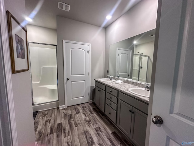 117 Edensmith Dr, New Market, AL 35761 - full bath featuring a shower stall, double vanity, and wood finished floors