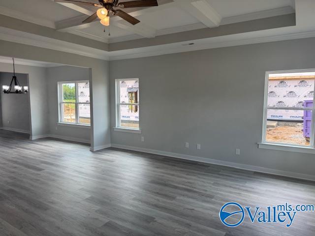 17194 Red Hill Rd, Athens, AL 35611 - spare room featuring coffered ceiling, a chandelier, crown molding, a ceiling fan, and beamed ceiling