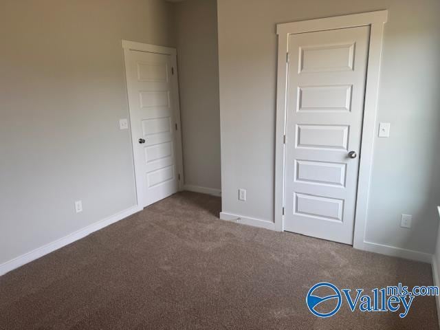 17194 Red Hill Rd, Athens, AL 35611 - unfurnished bedroom featuring carpet and baseboards
