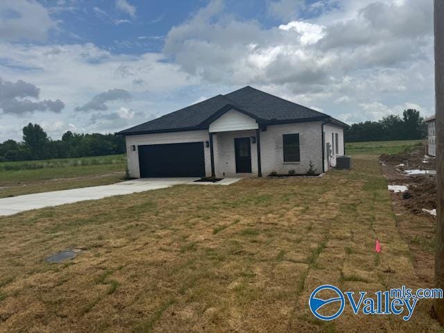 17194 Red Hill Rd, Athens, AL 35611 - view of front of home featuring concrete driveway, an attached garage, and a front yard