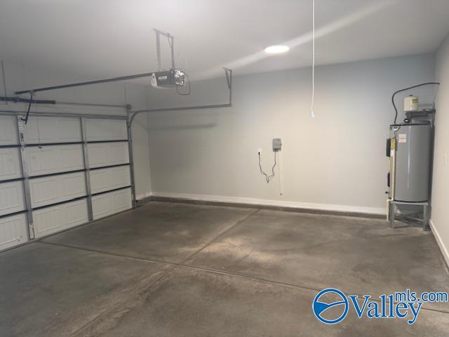 17194 Red Hill Rd, Athens, AL 35611 - garage featuring electric water heater and a garage door opener