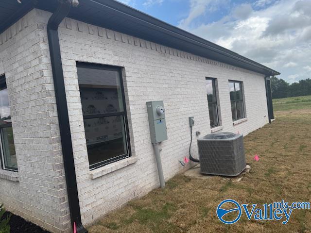 17194 Red Hill Rd, Athens, AL 35611 - view of home's exterior featuring brick siding and a yard