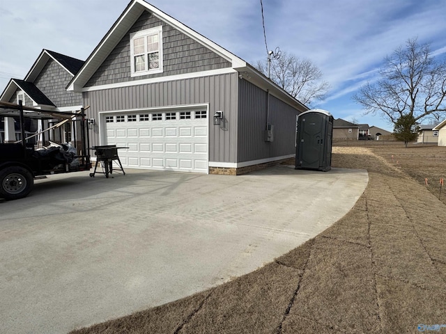 view of side of property with an outbuilding and a garage