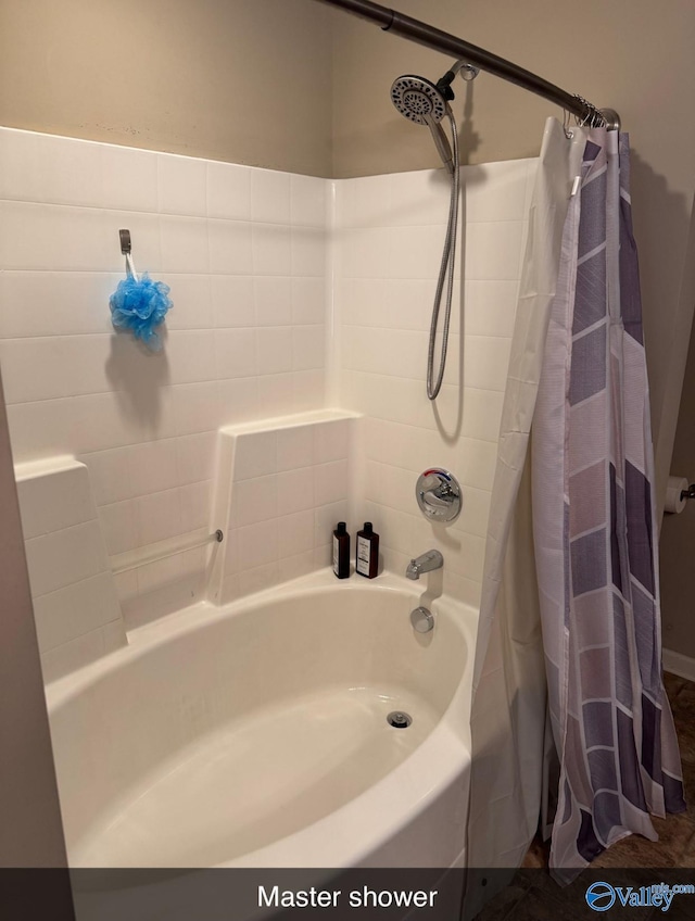bathroom featuring shower / bath combo with shower curtain