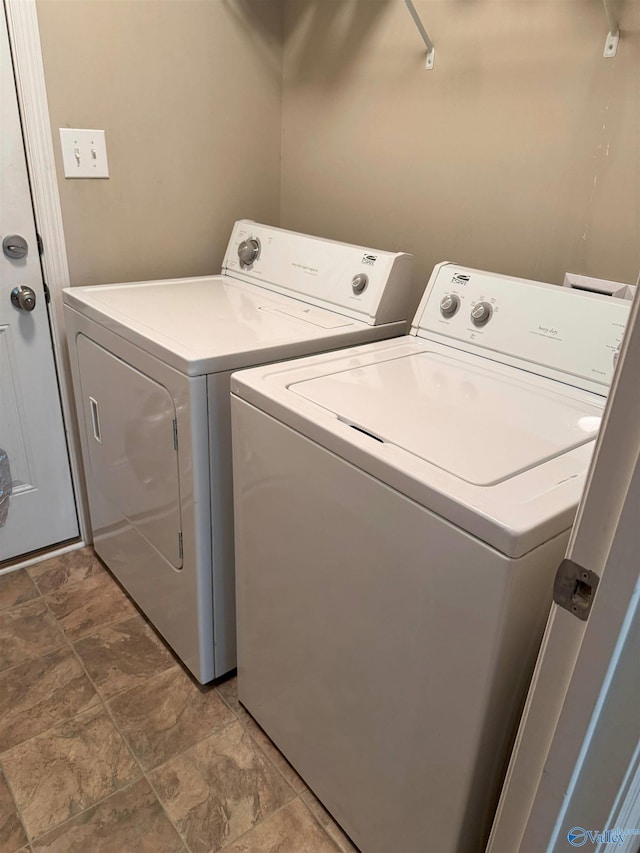 washroom with washer and clothes dryer and laundry area