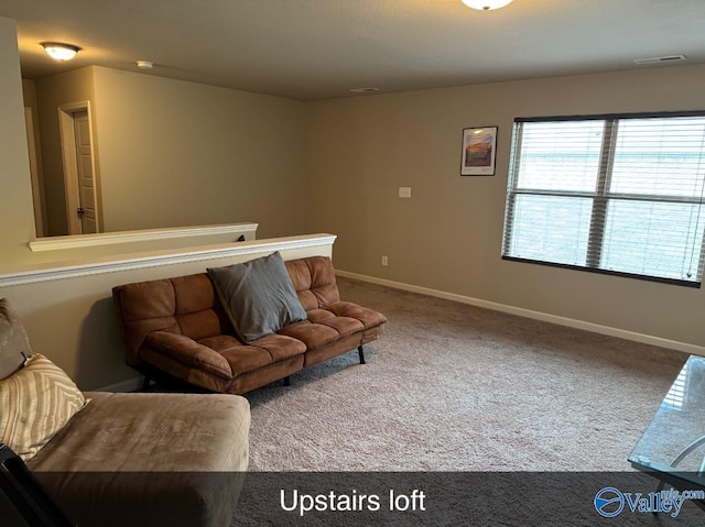living room featuring visible vents, carpet floors, and baseboards