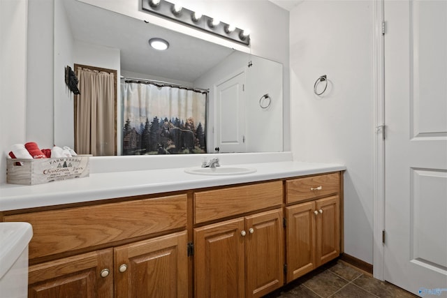 bathroom featuring tile patterned flooring and vanity