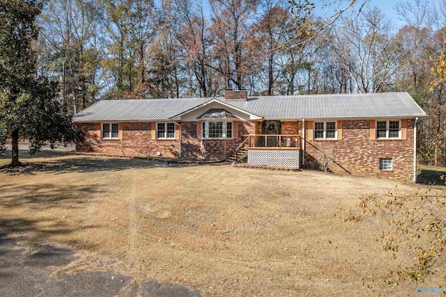 ranch-style home featuring a front yard