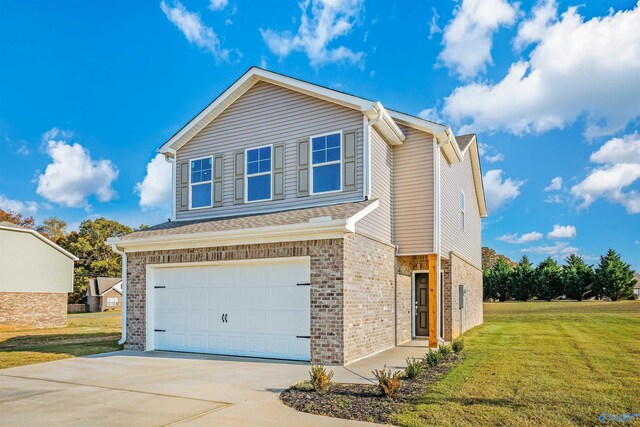 view of front of property featuring a front lawn and a garage