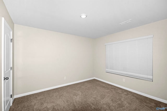 unfurnished room with carpet floors