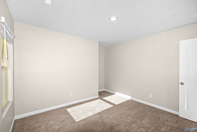 unfurnished room featuring carpet flooring