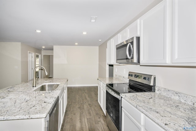 165 Meadowridge Dr, Hazel Green, AL 35750 - kitchen featuring appliances with stainless steel finishes, a sink, wood finished floors, white cabinets, and light stone counters