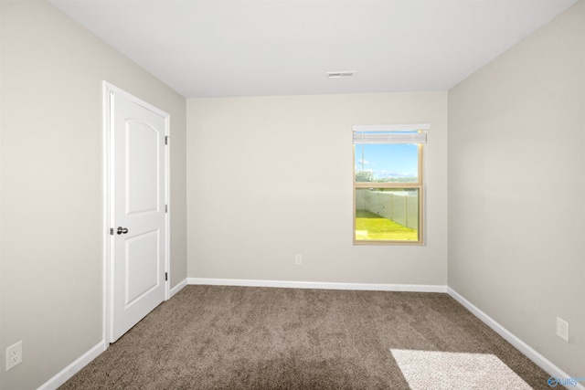 unfurnished room with carpet floors