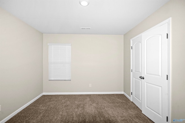 unfurnished bedroom featuring carpet floors