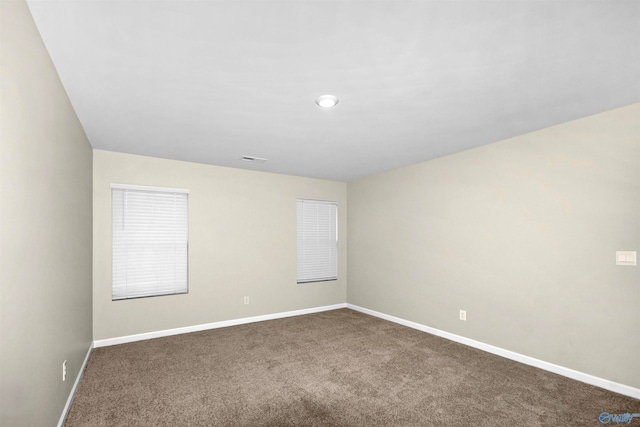 unfurnished room with carpet floors