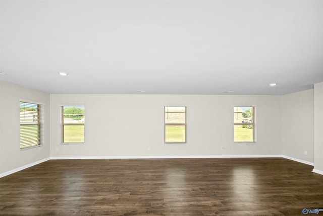 unfurnished room featuring dark hardwood / wood-style flooring