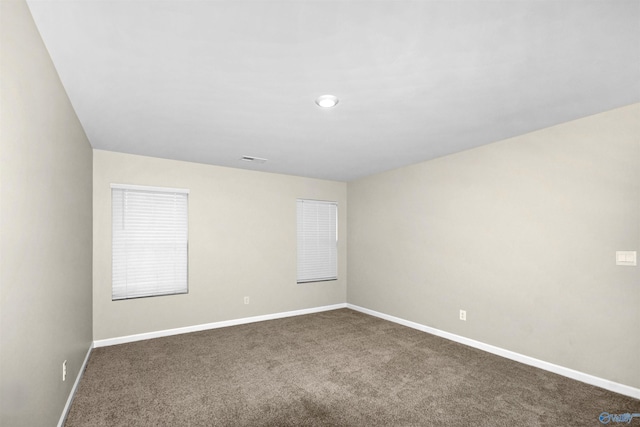 165 Meadowridge Dr, Hazel Green, AL 35750 - spare room with dark colored carpet and baseboards
