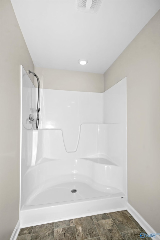 165 Meadowridge Dr, Hazel Green, AL 35750 - full bath featuring baseboards, a shower, and stone finish flooring