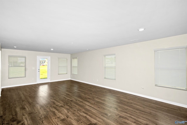 empty room with dark wood-type flooring