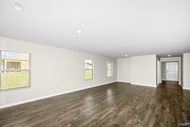165 Meadowridge Dr, Hazel Green, AL 35750 - unfurnished living room featuring dark wood-style floors, baseboards, and recessed lighting