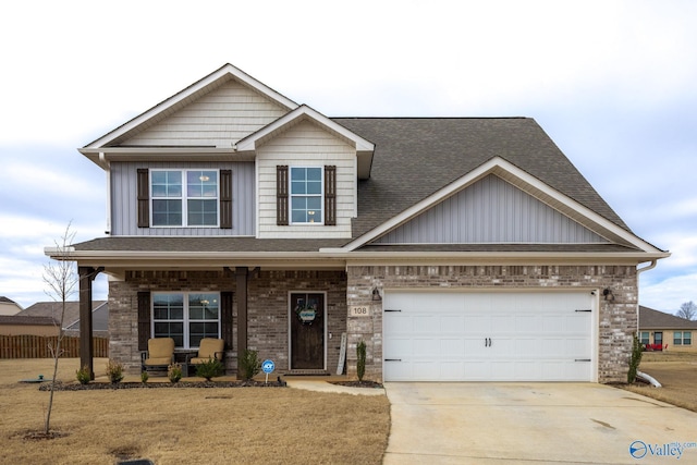 craftsman-style home featuring a garage, covered porch, and a front lawn