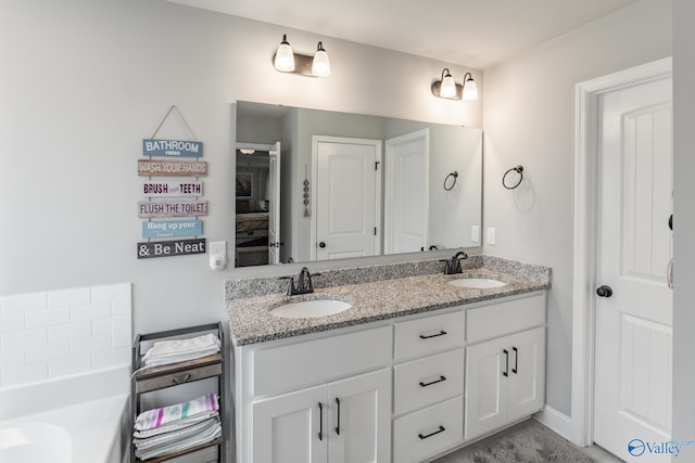 bathroom featuring vanity and a bathing tub