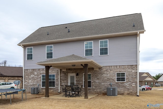 back of house with a patio and cooling unit