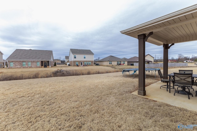 view of yard featuring a patio and a trampoline