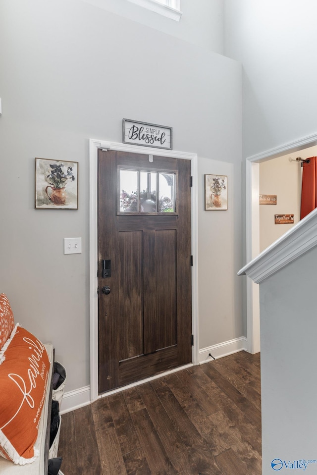 foyer with dark hardwood / wood-style floors