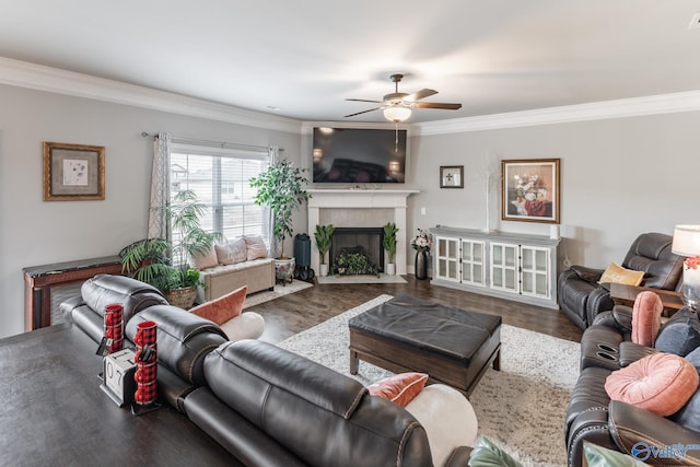 living room featuring crown molding, ceiling fan, and hardwood / wood-style floors