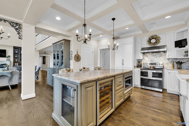 kitchen featuring wine cooler, a notable chandelier, appliances with stainless steel finishes, and ventilation hood