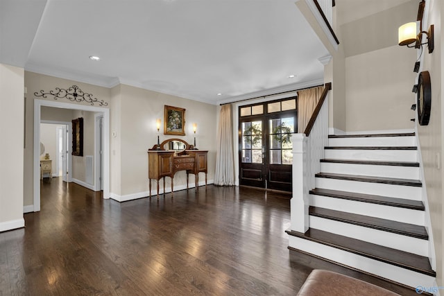 entryway featuring wood finished floors, recessed lighting, crown molding, baseboards, and stairs