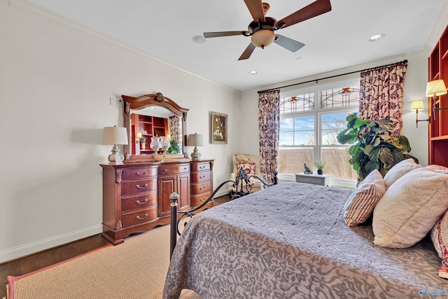 bedroom with wood finished floors, baseboards, recessed lighting, ceiling fan, and crown molding