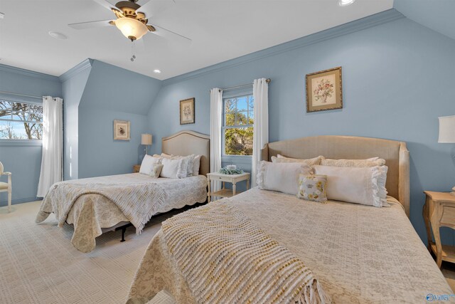 bedroom with lofted ceiling, a ceiling fan, crown molding, and carpet