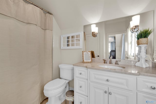 bathroom featuring vanity, a shower with shower curtain, toilet, and lofted ceiling