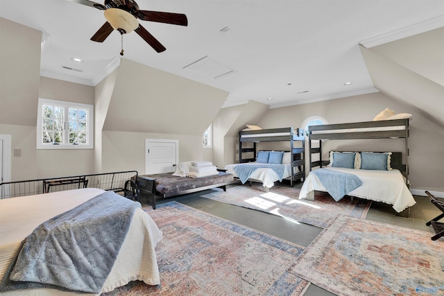 bedroom featuring baseboards, attic access, ceiling fan, ornamental molding, and vaulted ceiling