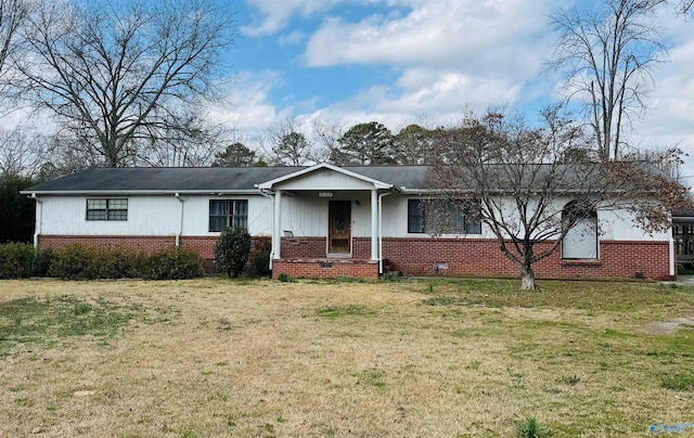 single story home with a front yard and brick siding