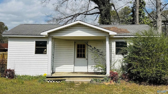 exterior space with a shingled roof