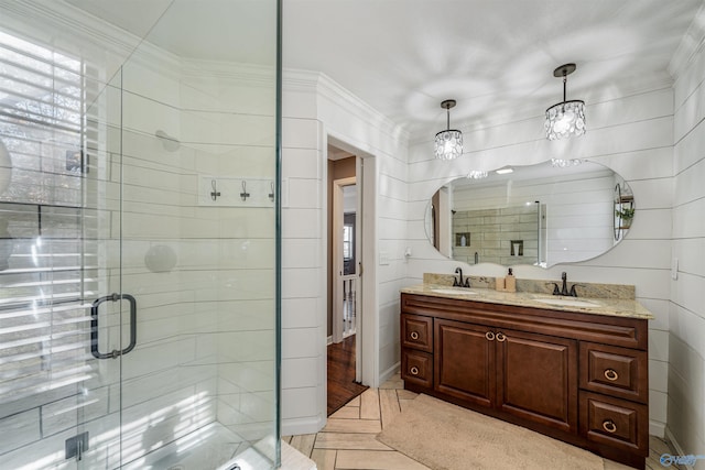 bathroom with crown molding, vanity, hardwood / wood-style flooring, and walk in shower