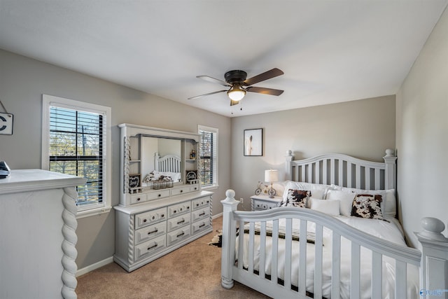 bedroom featuring ceiling fan and light colored carpet