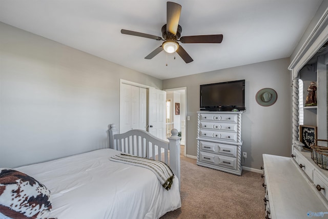 carpeted bedroom with a closet and ceiling fan