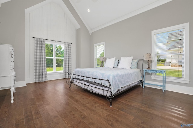 bedroom with baseboards, crown molding, high vaulted ceiling, and dark wood-style flooring