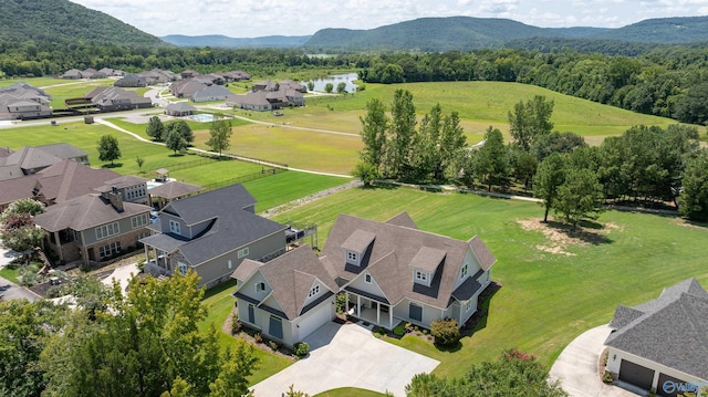 birds eye view of property featuring a residential view and a water and mountain view