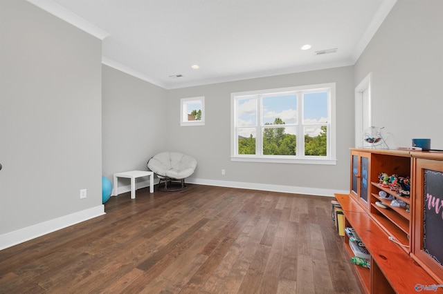 sitting room featuring baseboards, dark wood-style flooring, recessed lighting, and crown molding