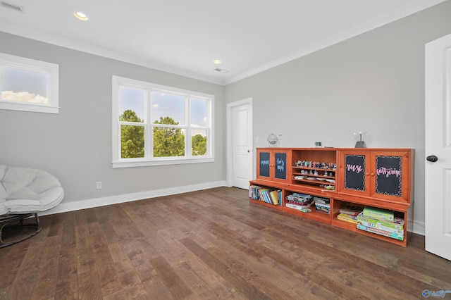 interior space with crown molding, recessed lighting, visible vents, wood finished floors, and baseboards