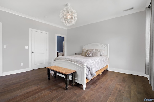 bedroom featuring a chandelier, dark wood-type flooring, visible vents, and baseboards