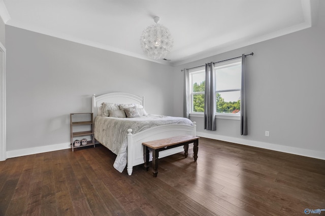 bedroom featuring dark wood-style flooring, crown molding, and baseboards