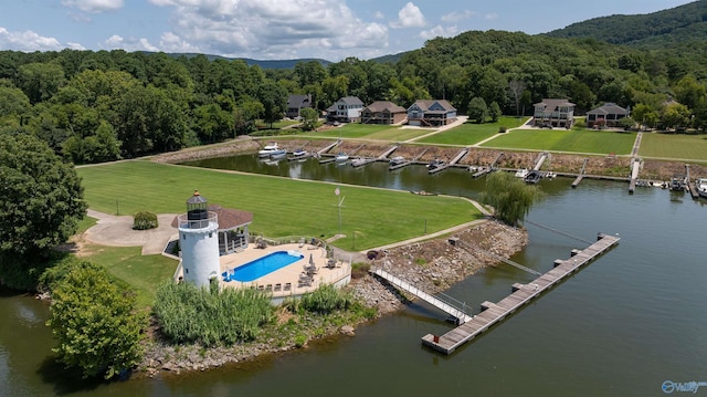 aerial view featuring a water view and a wooded view