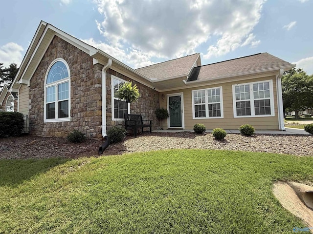 2072 Madison Villas Way Unit 2072, Madison, AL 35758 - view of front of home featuring stone siding, a front yard, and a shingled roof